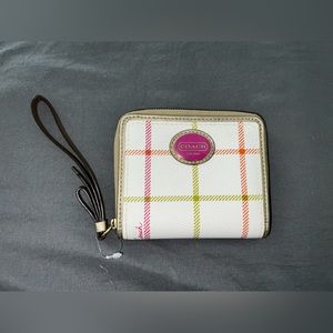 Coach wallet with wristlet attachment.